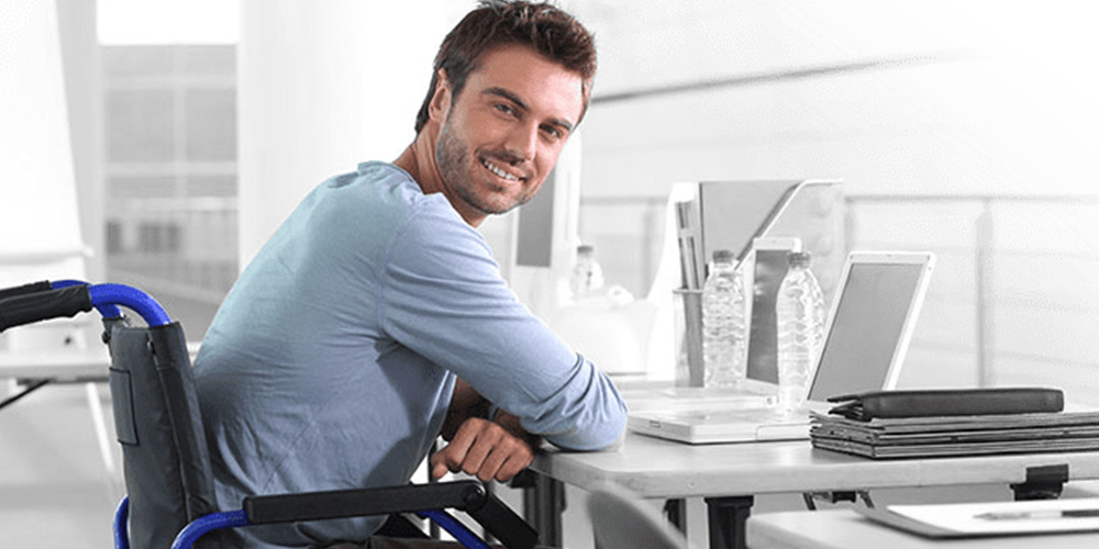 personal injury disabled man sitting at desk